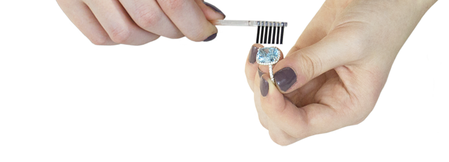 Jewelry brush cleaning a ring