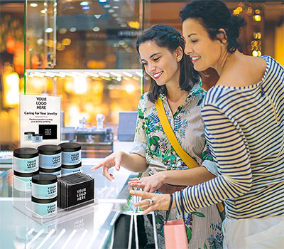 Two women looking at a Kingswood Jewelry Cleaner Display